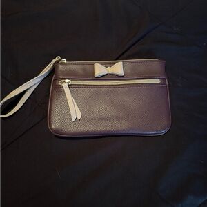 Dark purple wristlet with small bow.